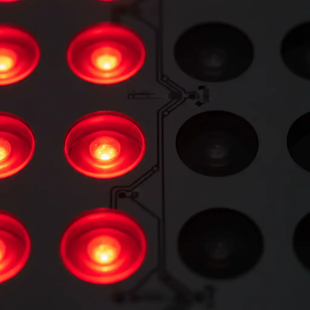 Close-up comparison of red light therapy panel showing visible 660nm LEDs and invisible 850nm near-infrared LEDs